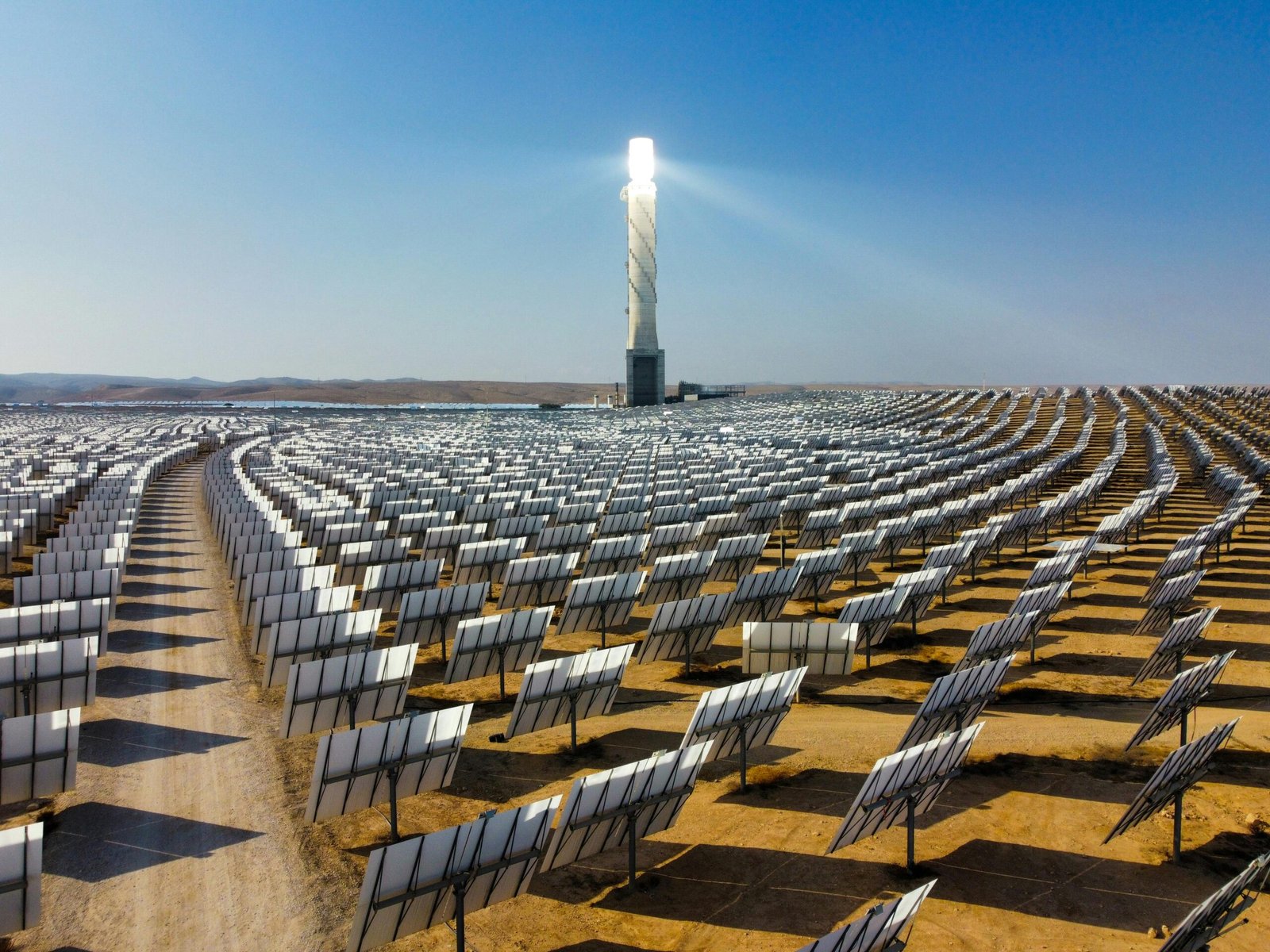 pexels-photo-13248712-13248712 Vast array of solar panels at Ashalim Solar Plant in Israel's Negev Desert, showcasing clean energy.